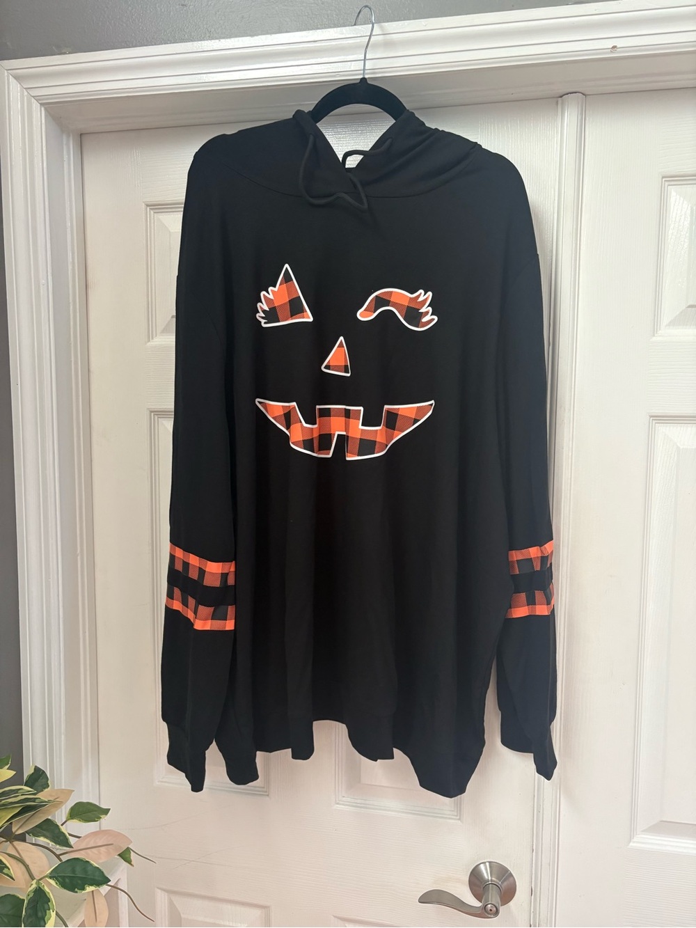BloomChic Black Hoodie with Orange Plaid Pumpkin Face